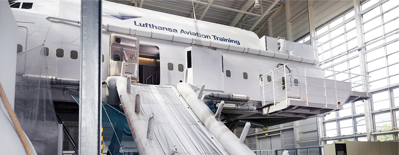 A Cabin Emergency Evacuation Trainer (CEET) with rescue chute in a training centre