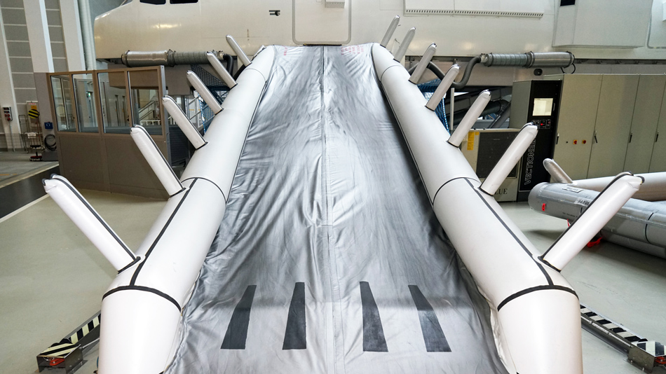 Rescue slide on a Cabin Emergency Evacuation Trainer (CEET) in a training hall